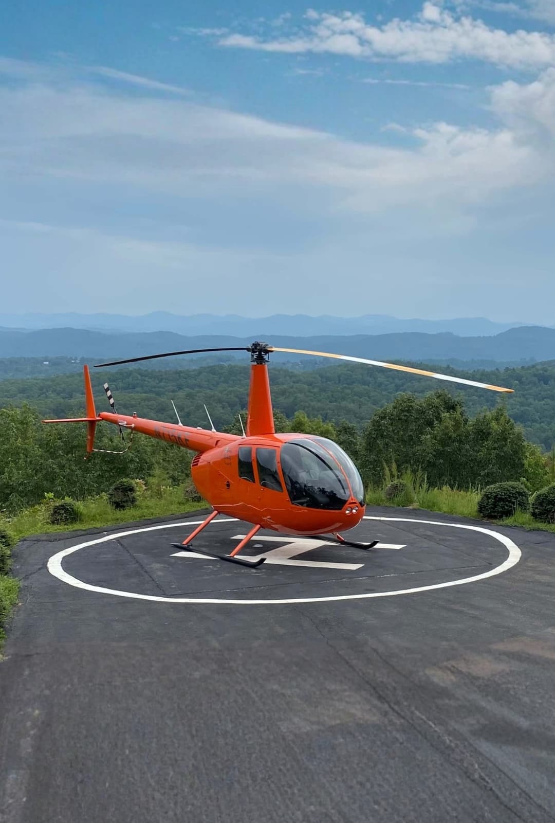 Helicopters – Robinson helicopter on mountain helipad