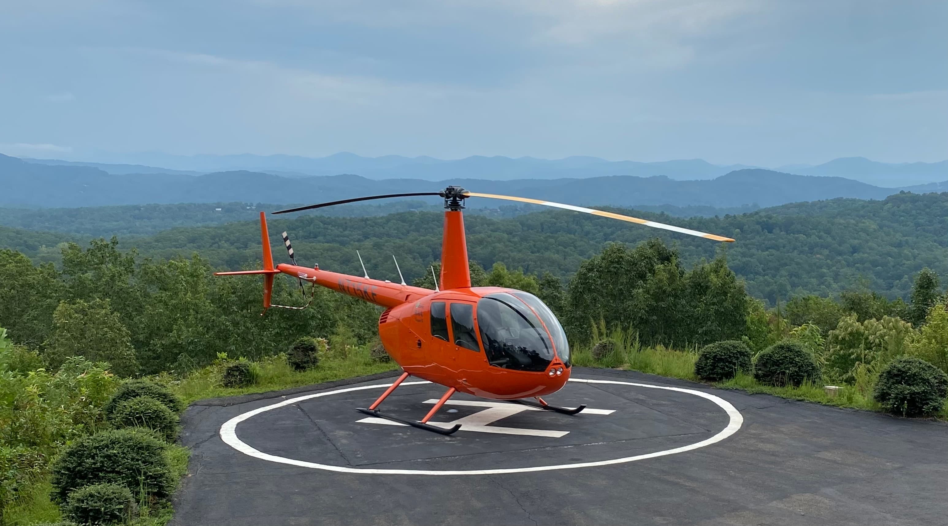 Helicopters – Robinson helicopter on mountain helipad