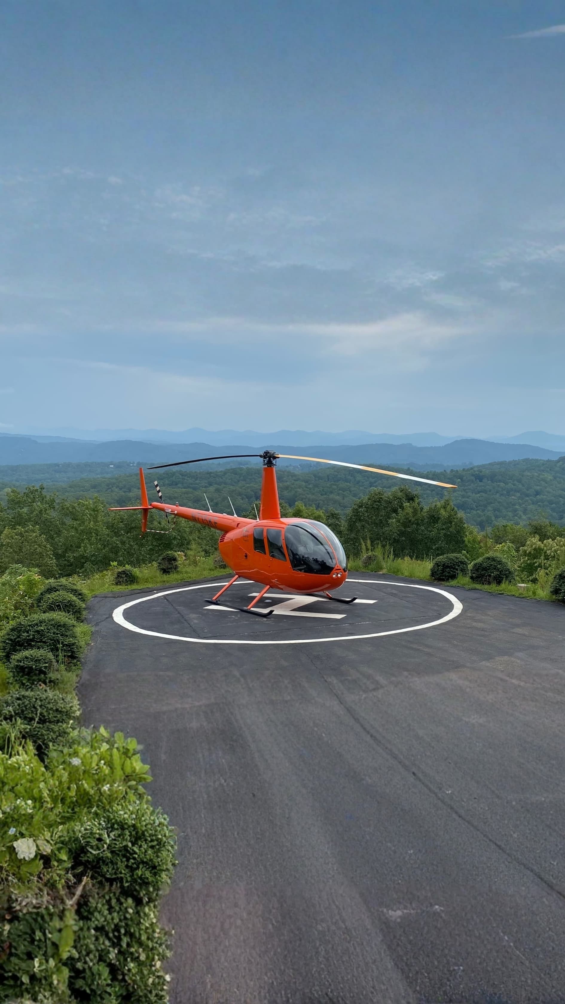 Helicopters – Robinson helicopter on mountain helipad